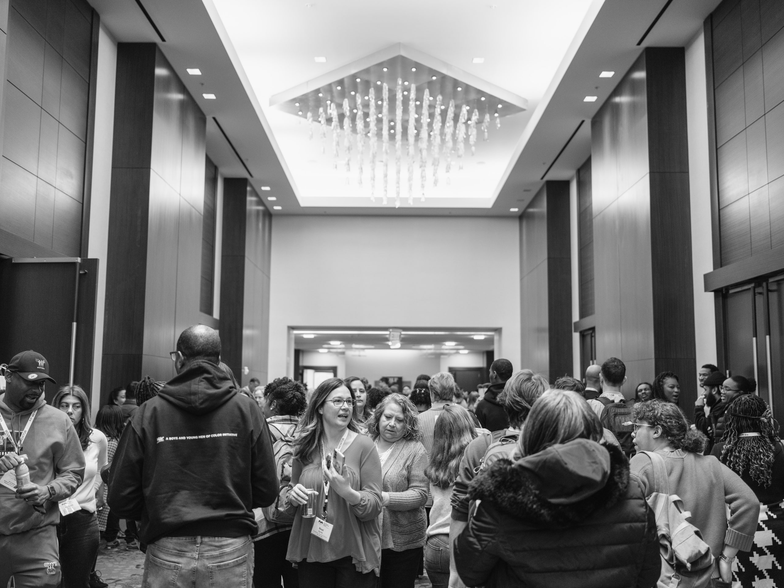 B&w ballroom wide, ceiling carries it.