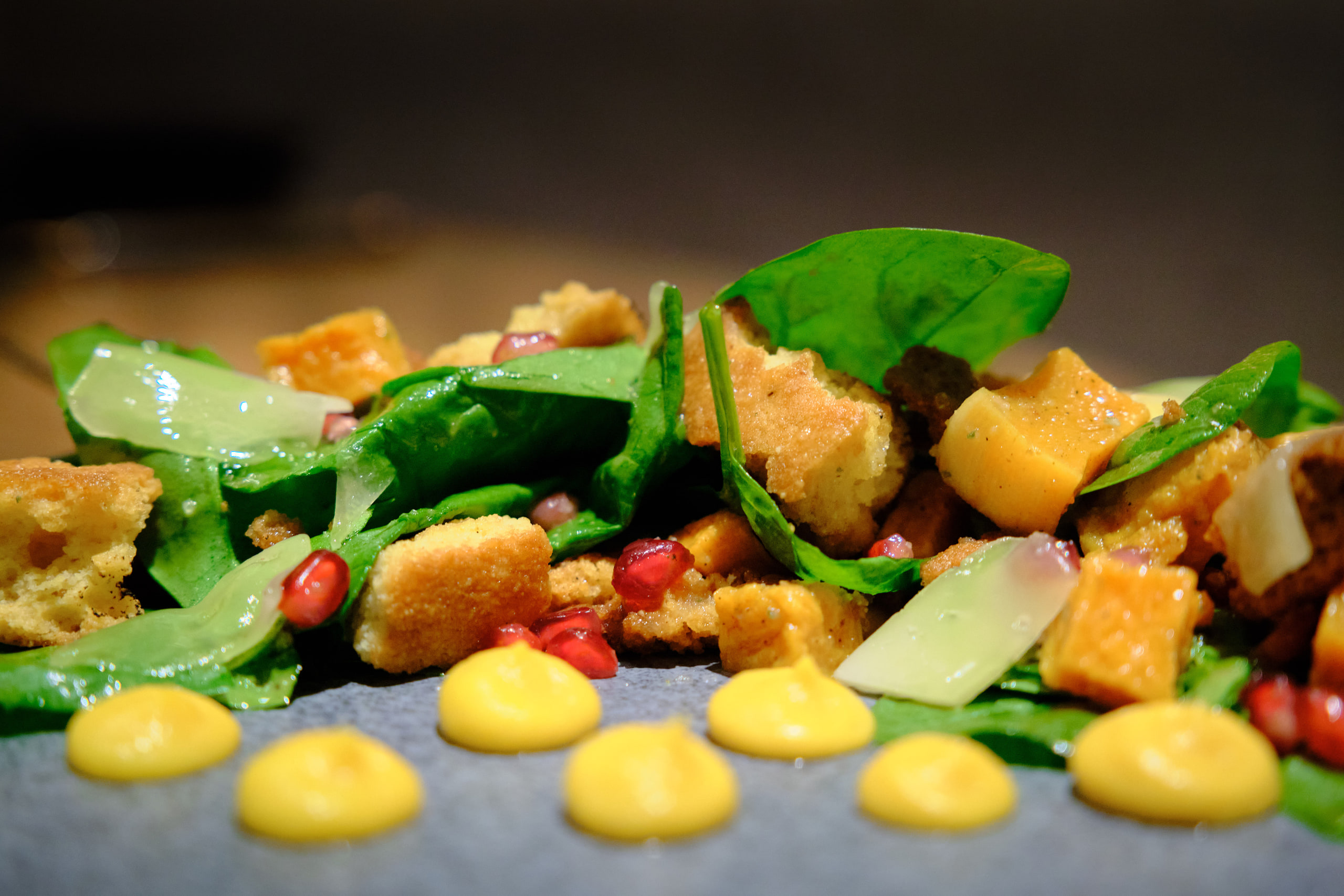 Bright salad on dark, saturated.