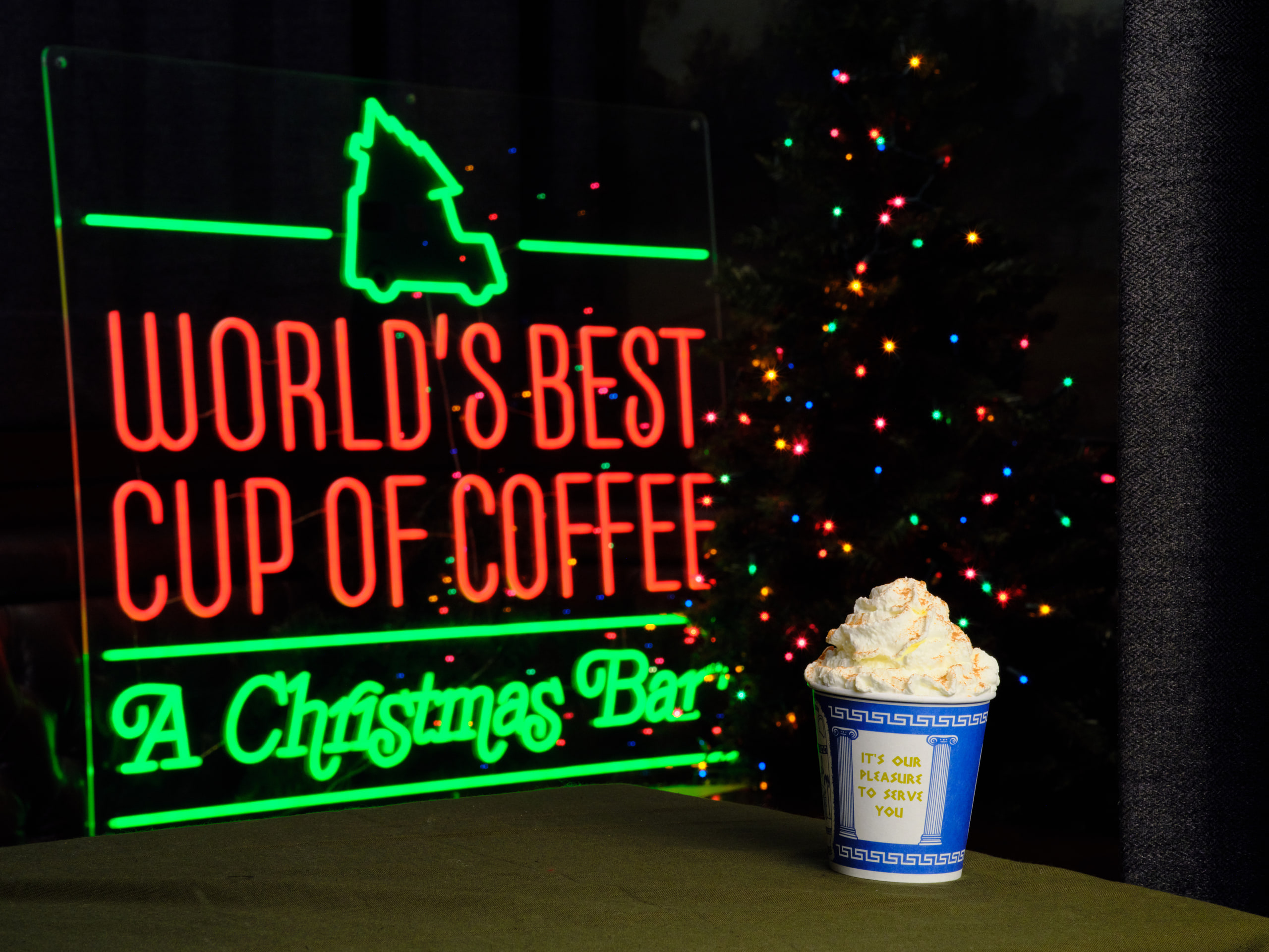 Neon sign and ice cream, color on black.