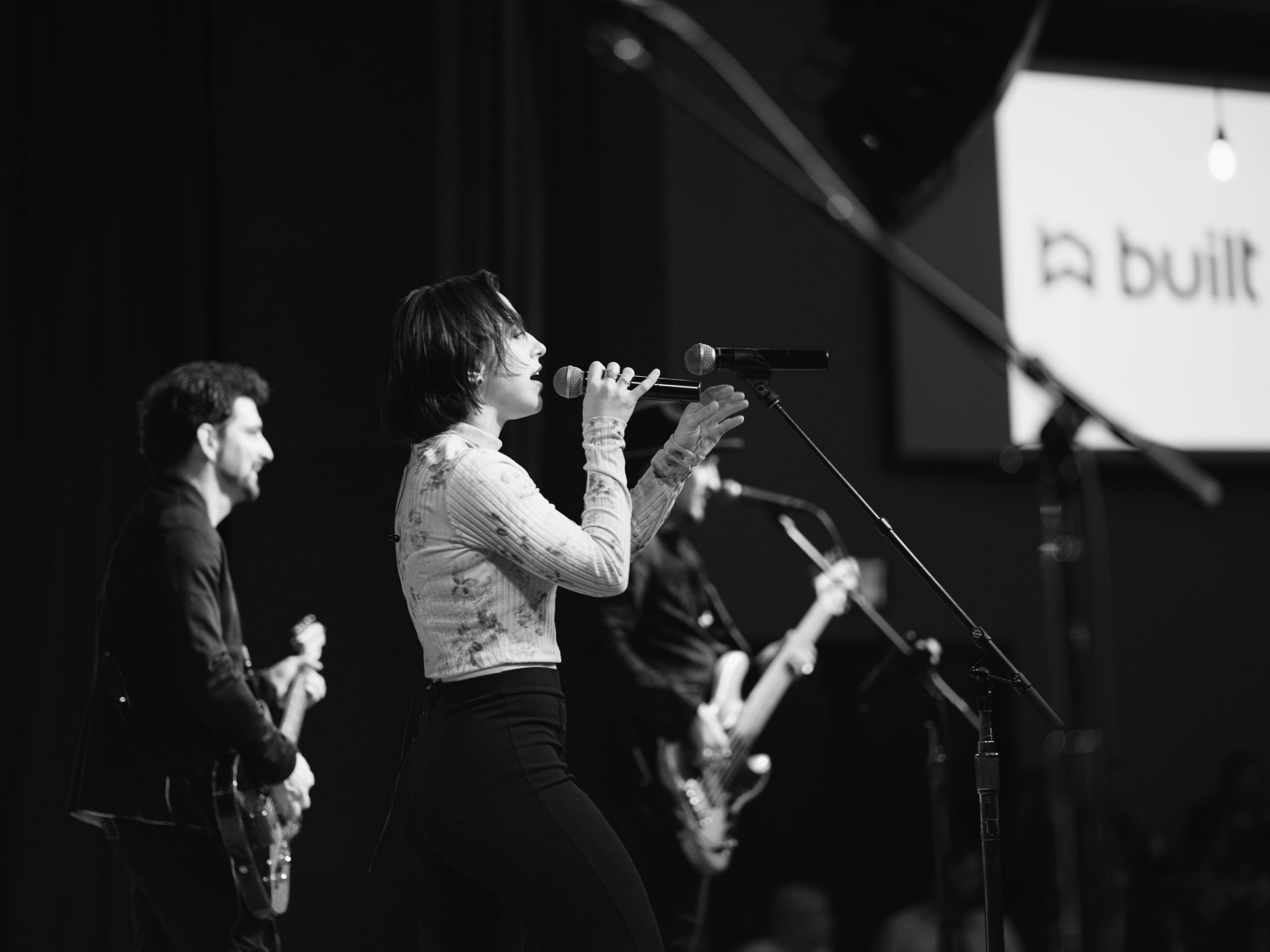 B&w stage, performer small in it.