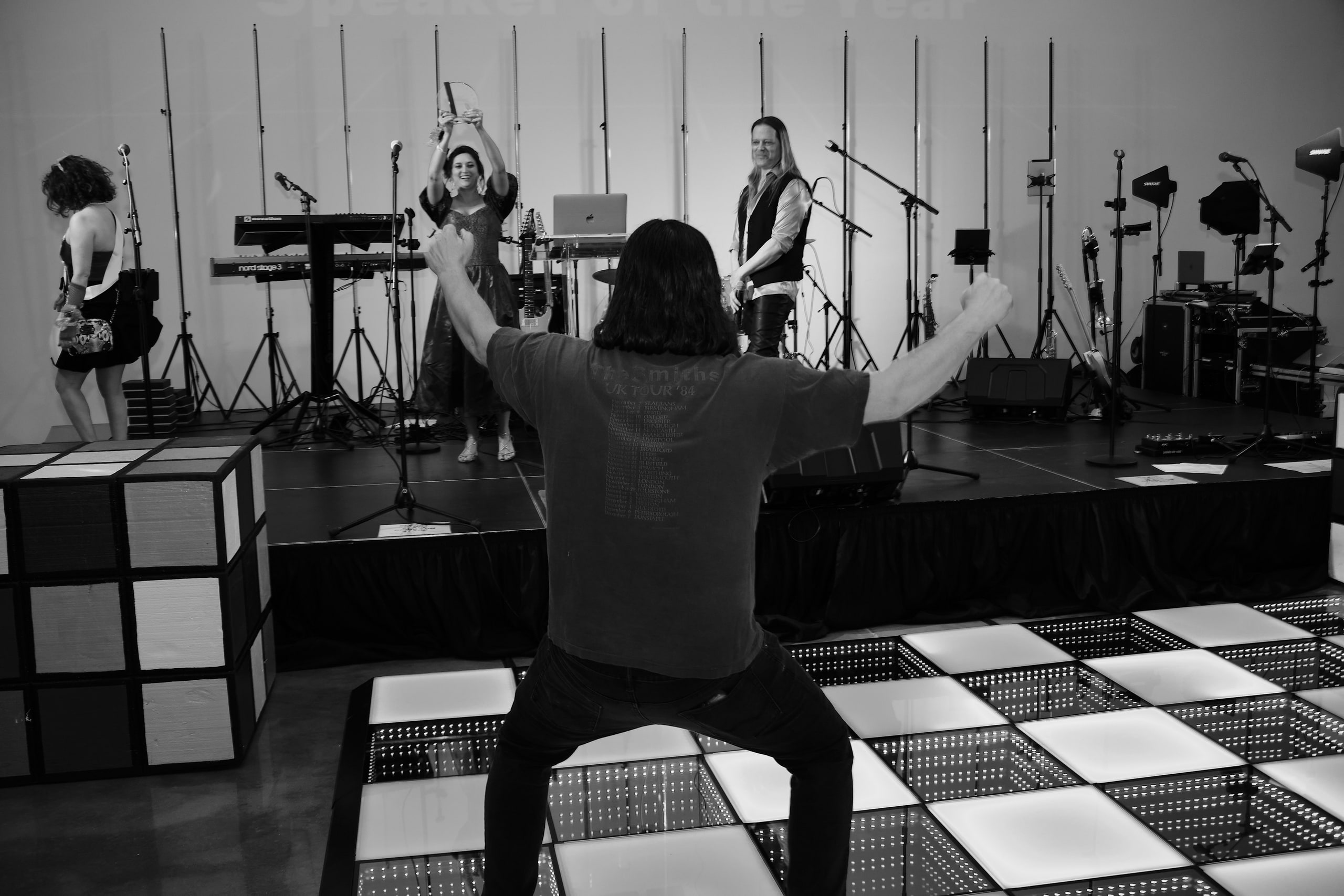 B&w stage wide, room and scale.