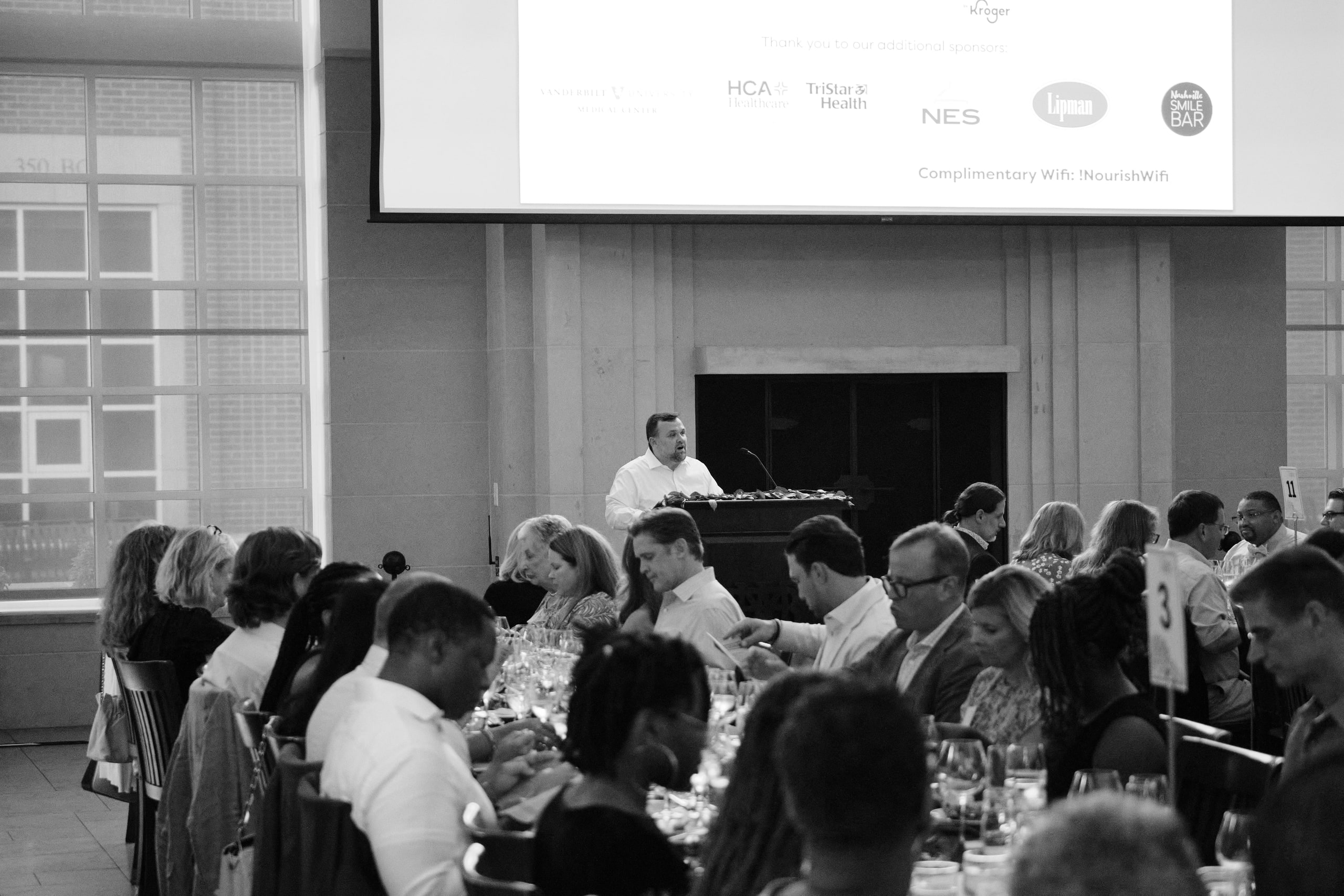 B&w audience wide, scale of the room.