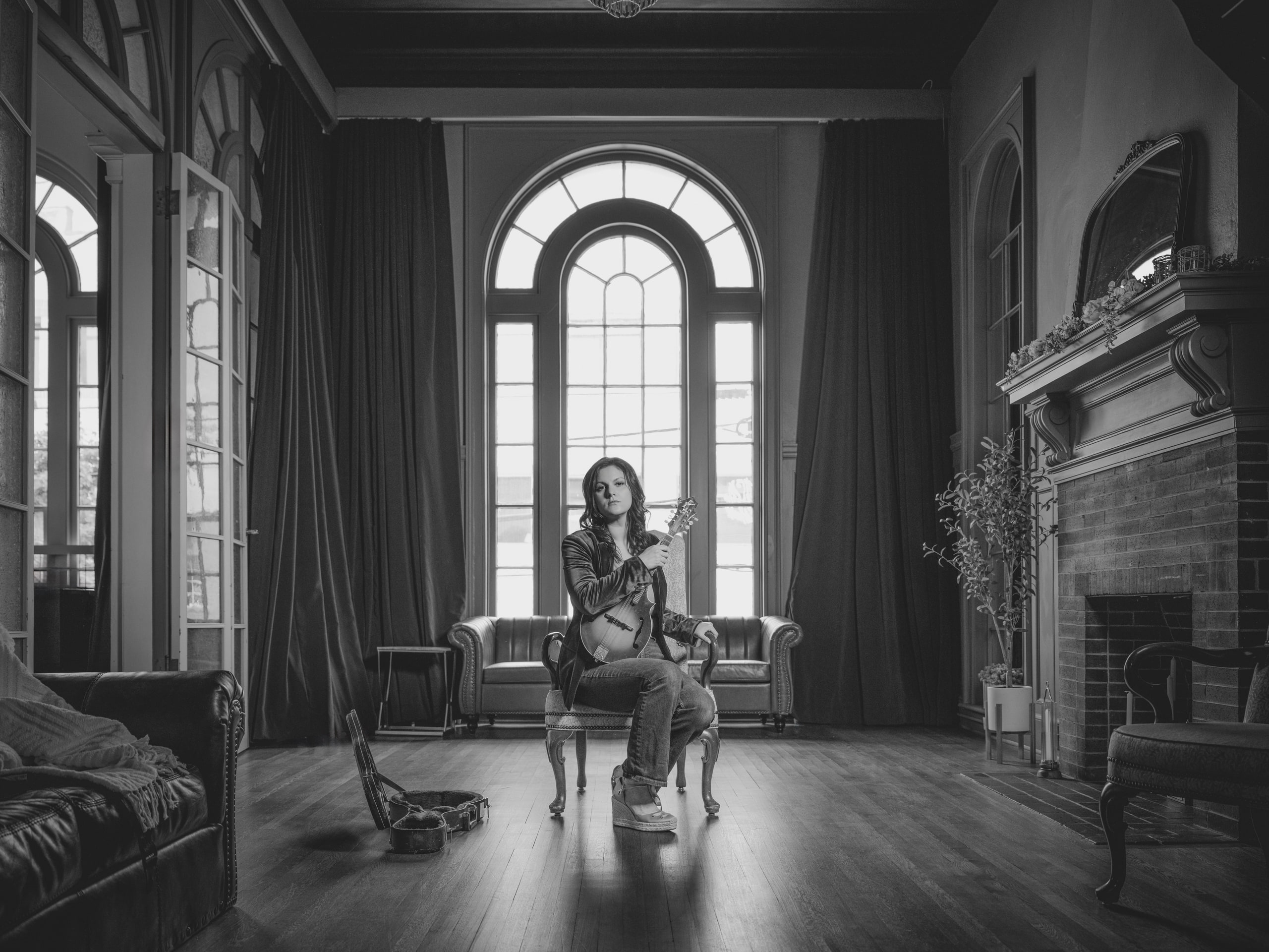 Brick hall, tall windows, empty and honest.