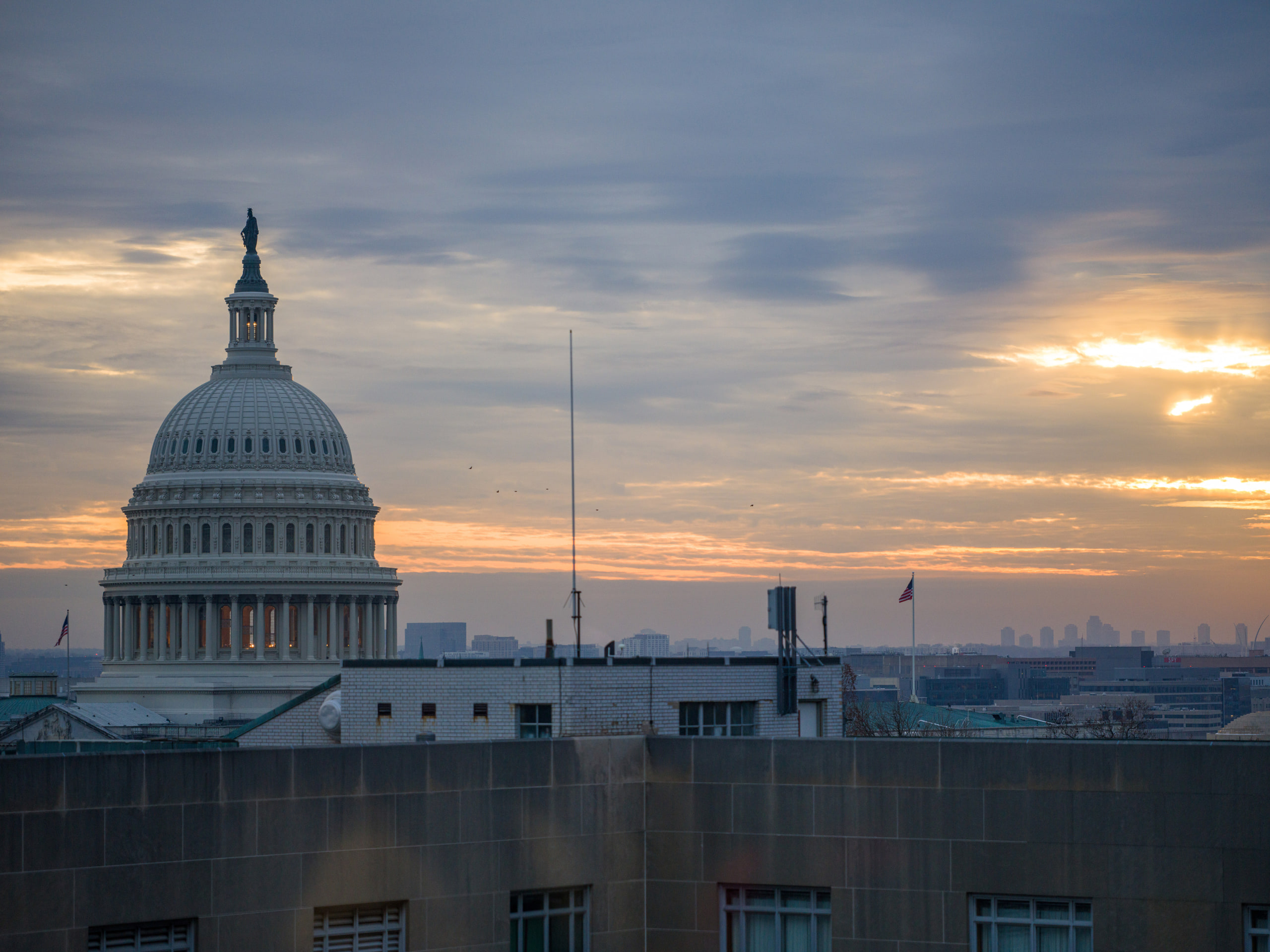 Capitol at dusk, dramatic sky, establishes DC.