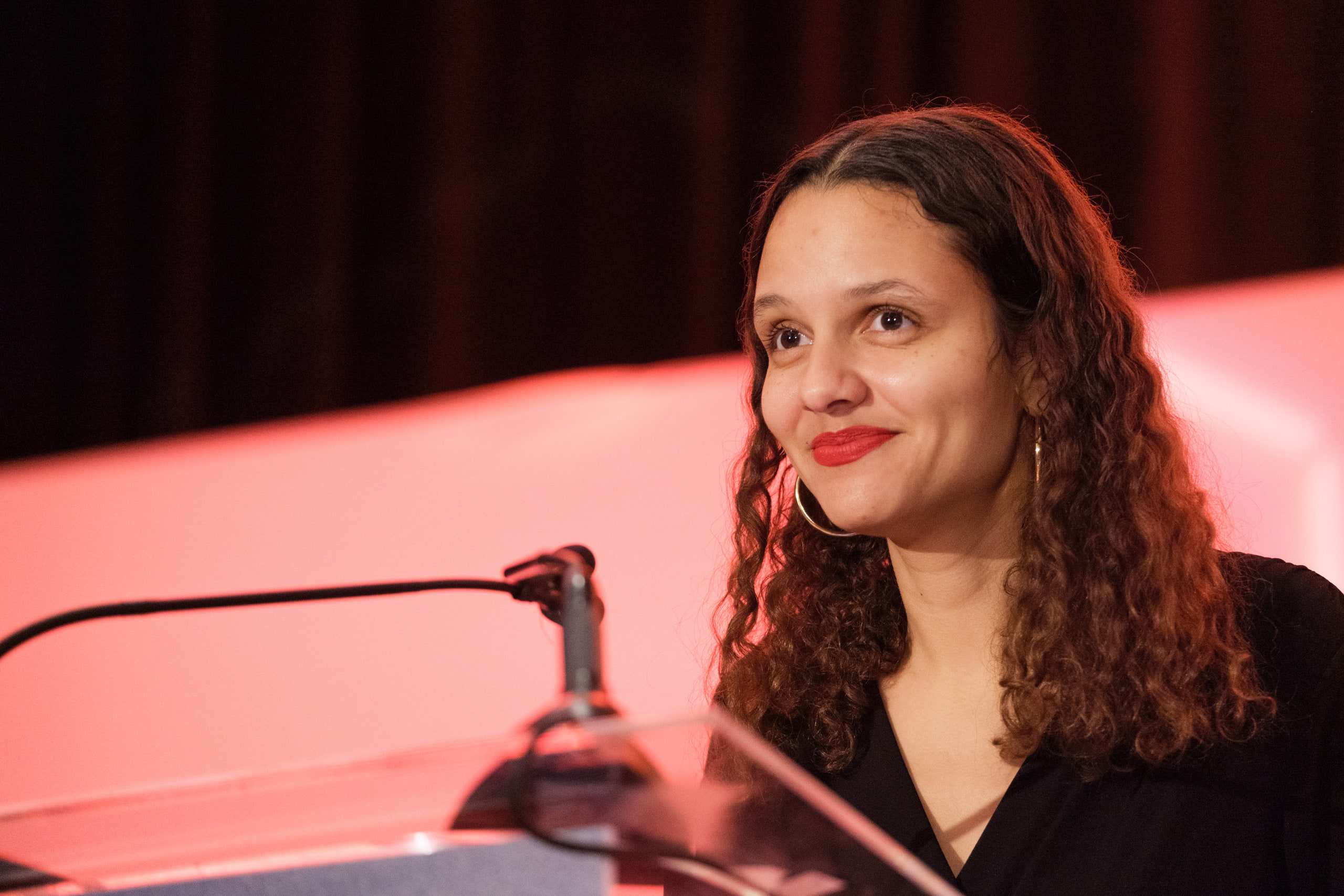 Speaker at a red podium.