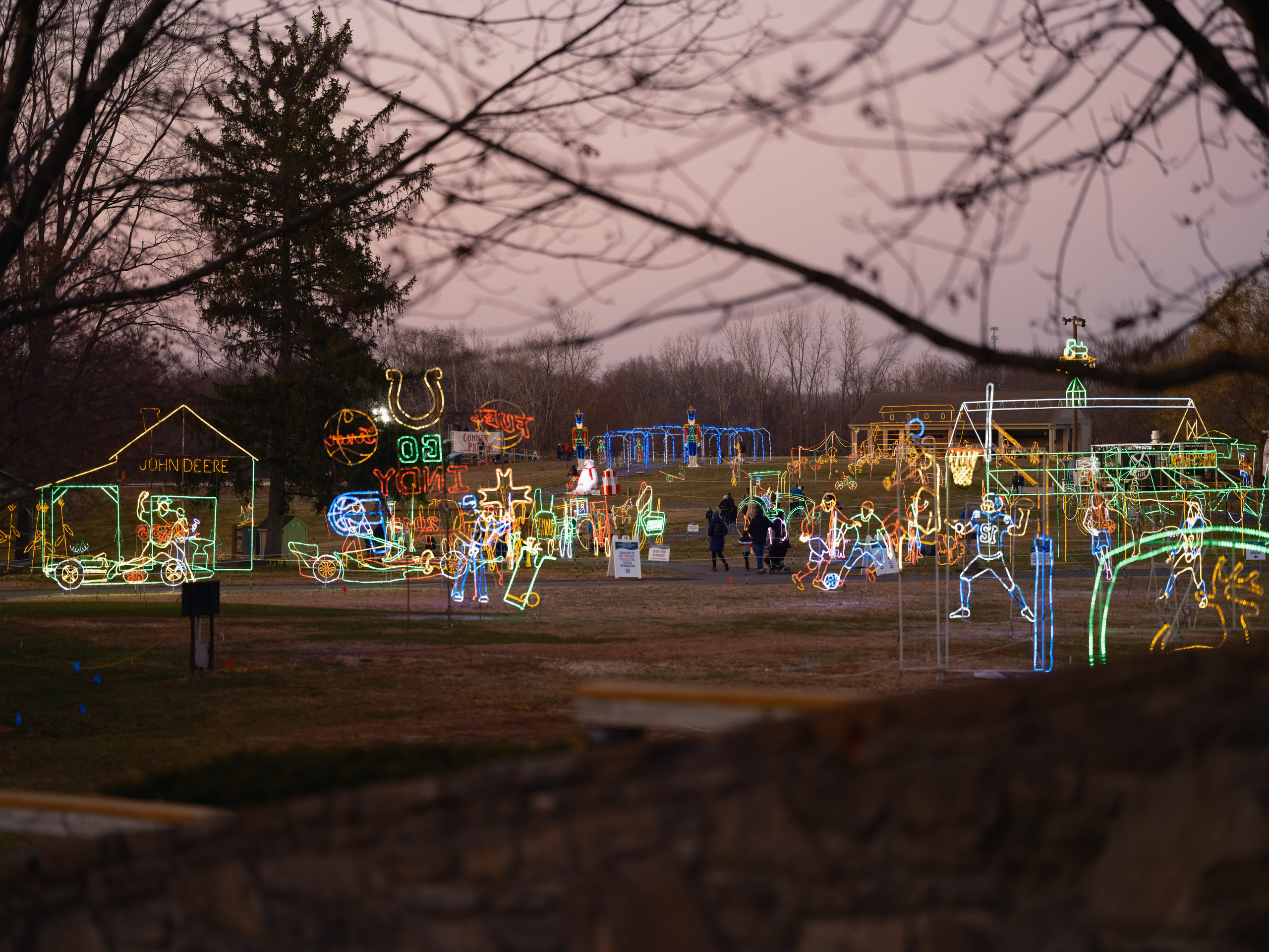 The grounds at dusk, lights coming on.