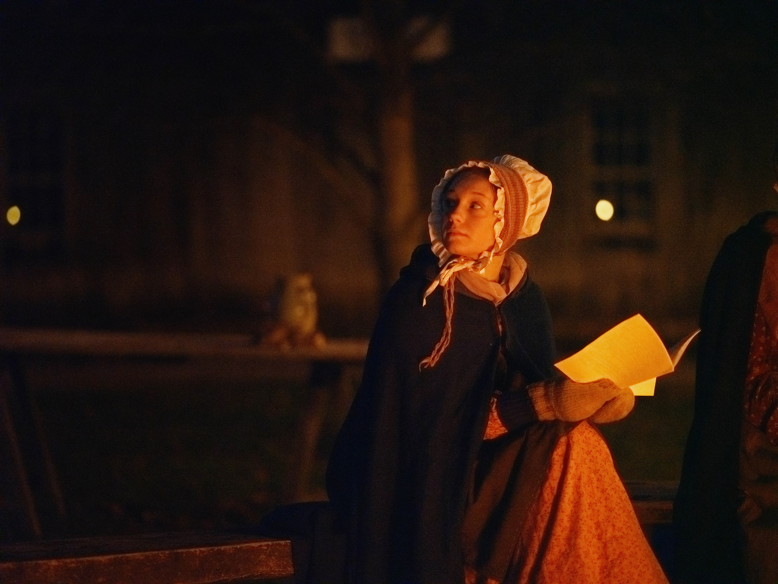 Woman in period dress by candlelight, painterly.