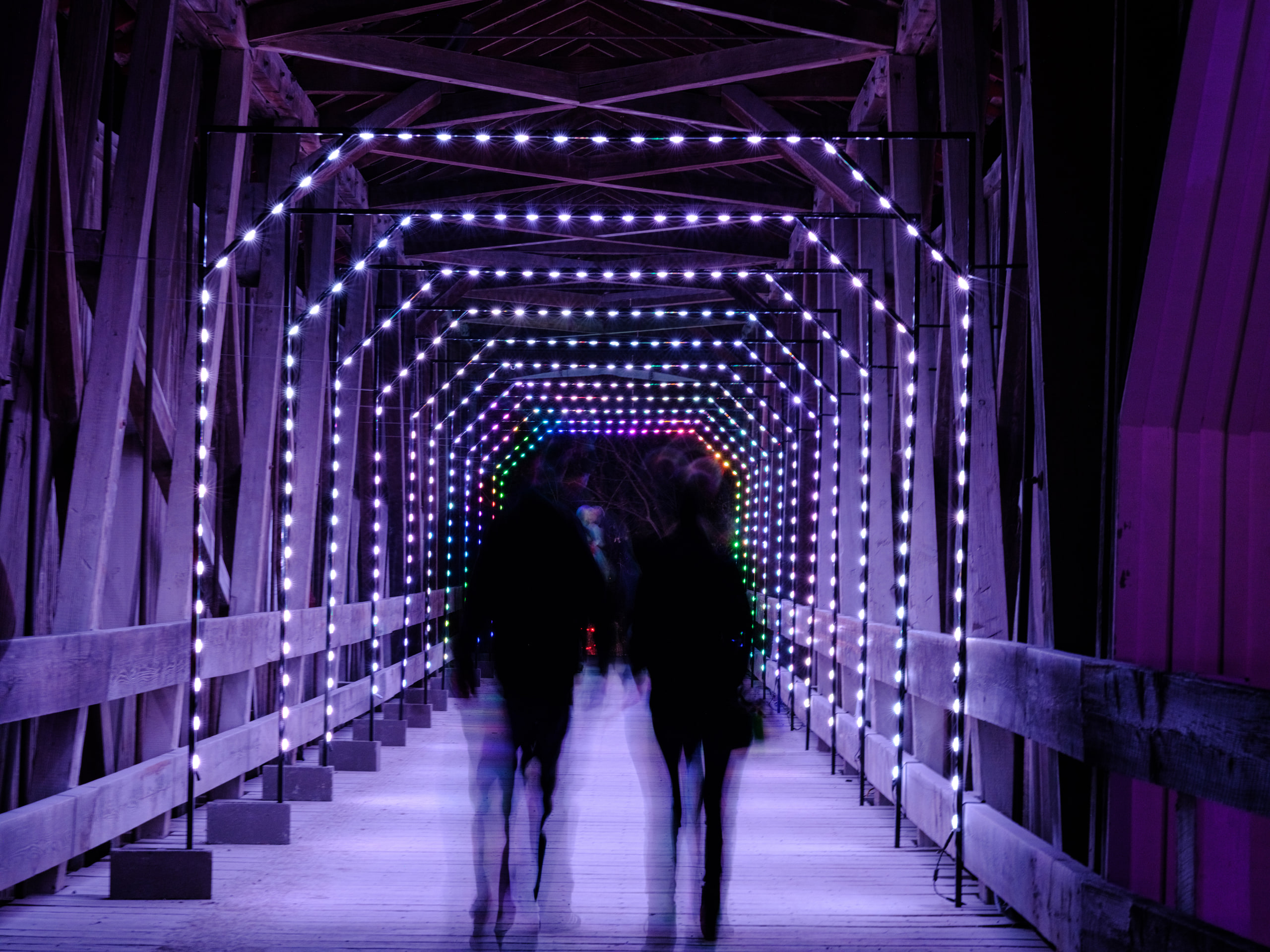 Light tunnel with one silhouette inside it.