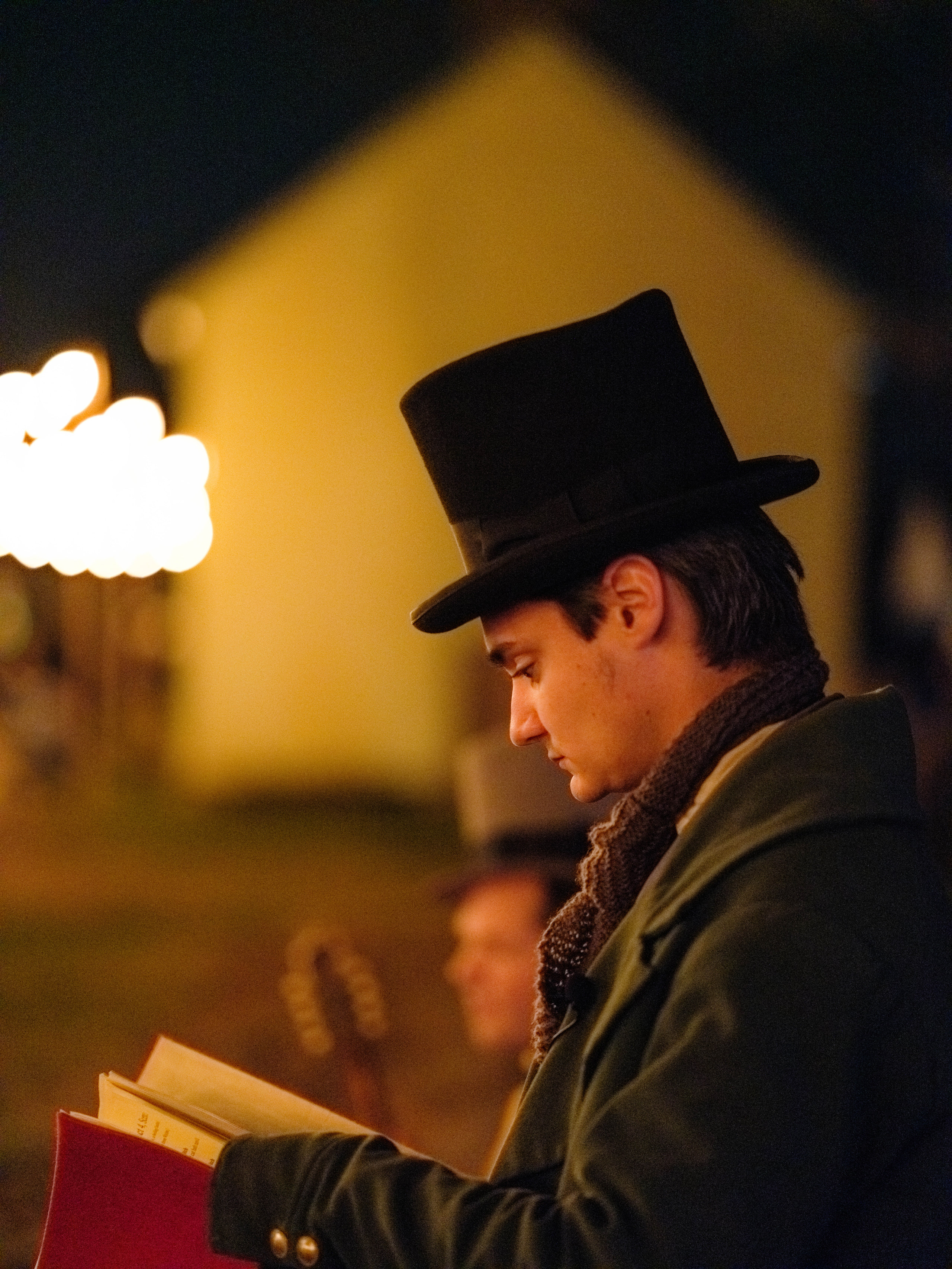 Top hat by lamplight, character and warmth.