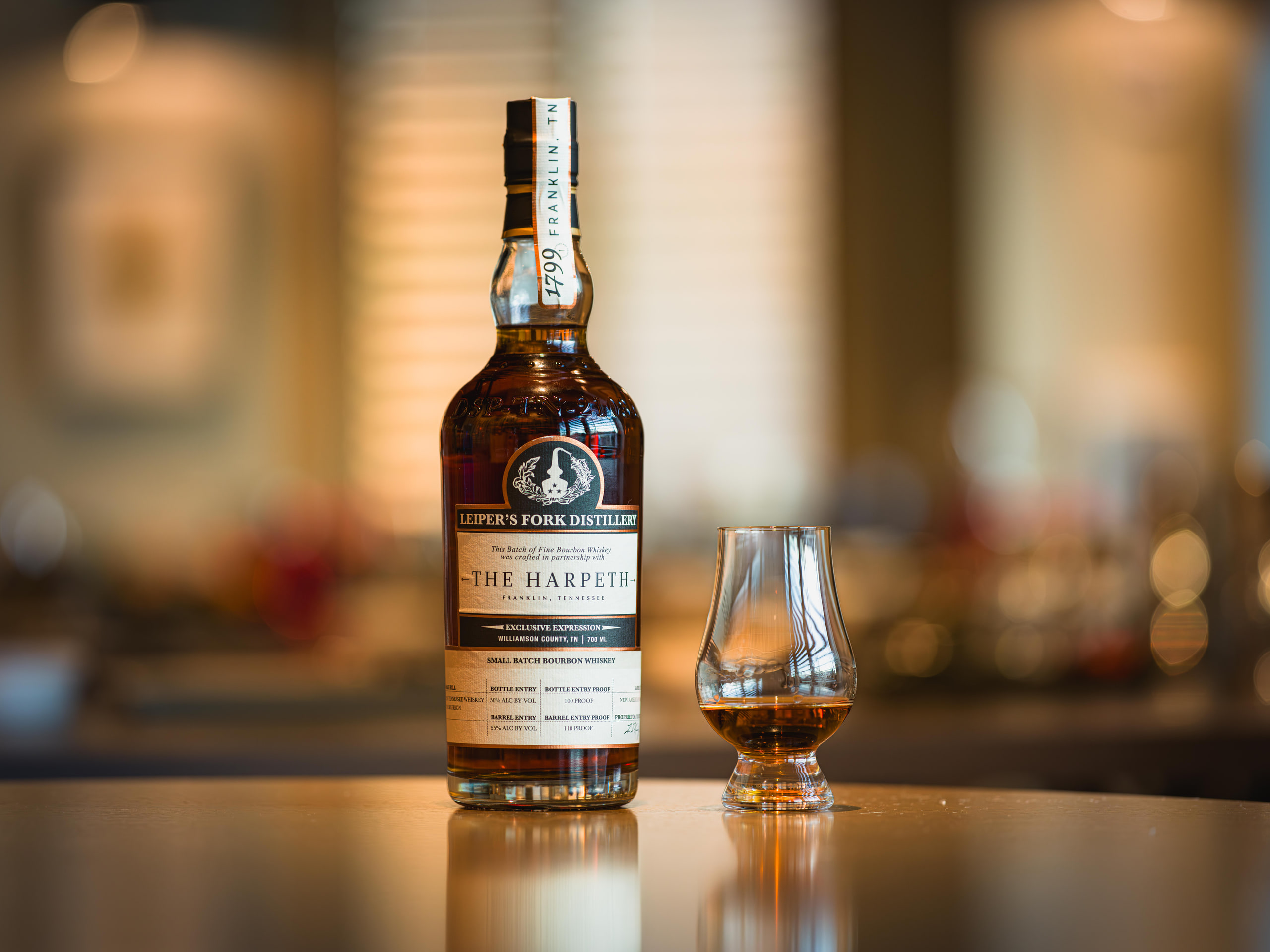 Whiskey and a glass, low key.