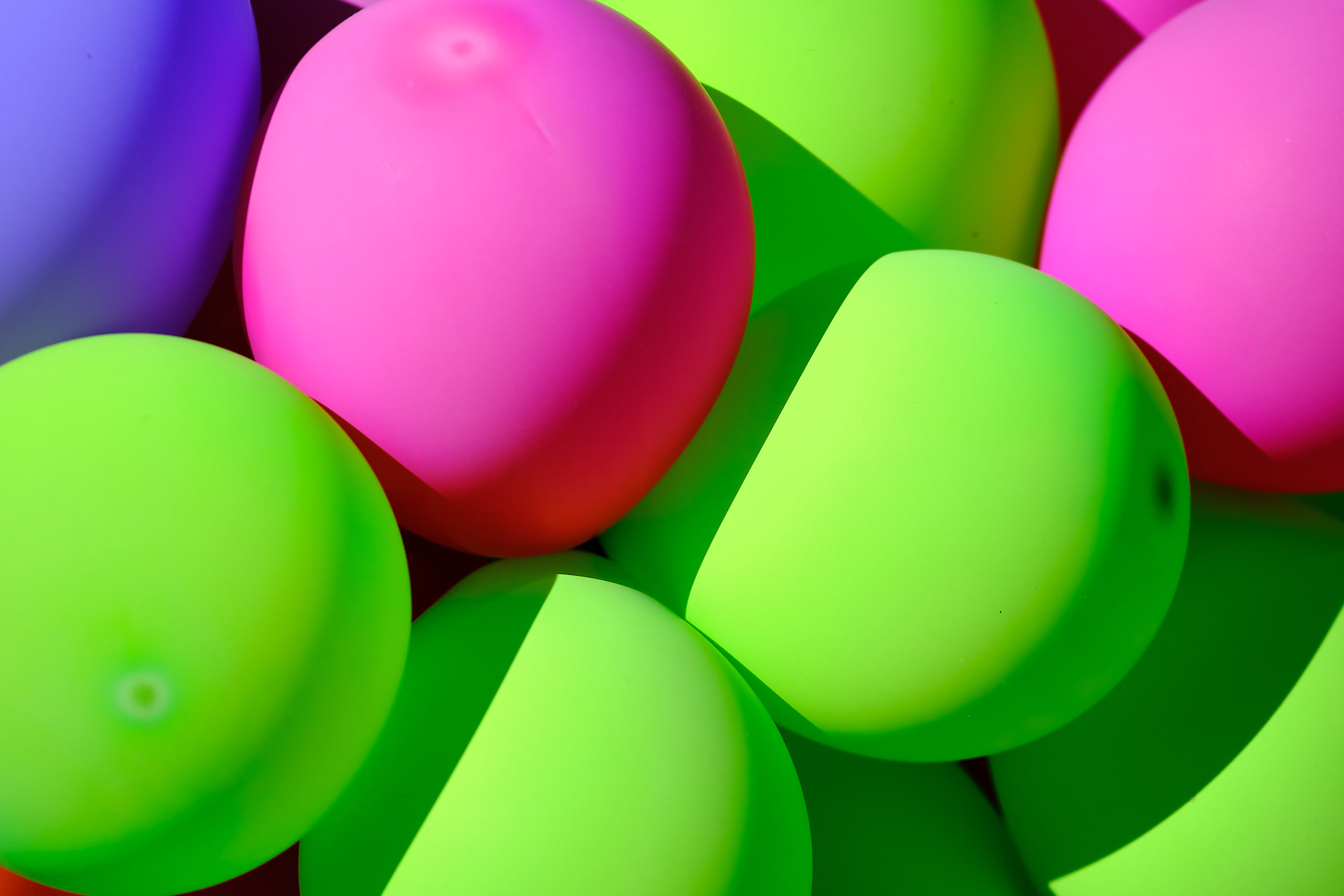 Pink and green balloons, pure color field.