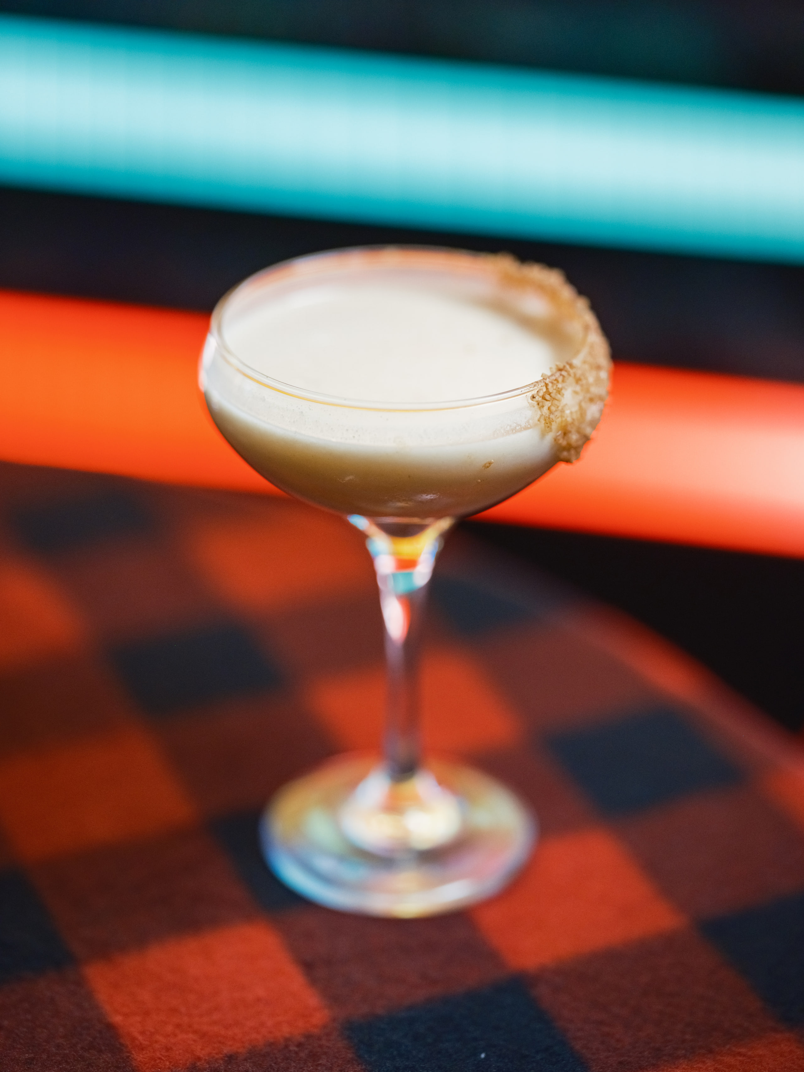 Coupe glass, neon streak behind.
